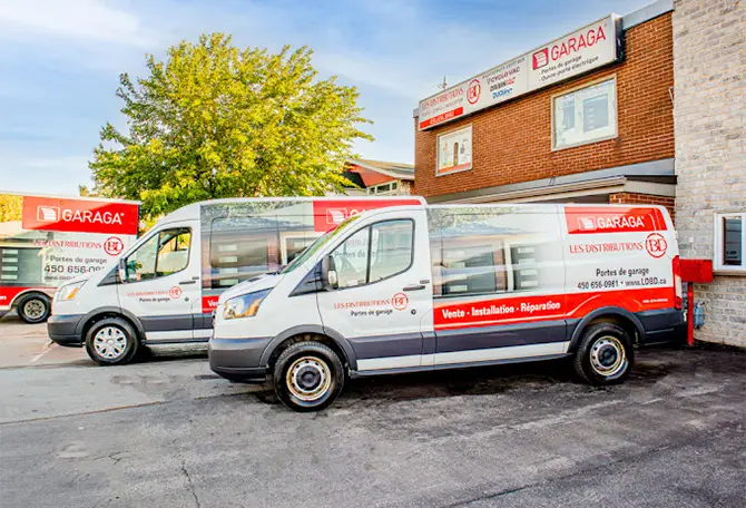 Service trucks from Distribution B.D. in front of their office